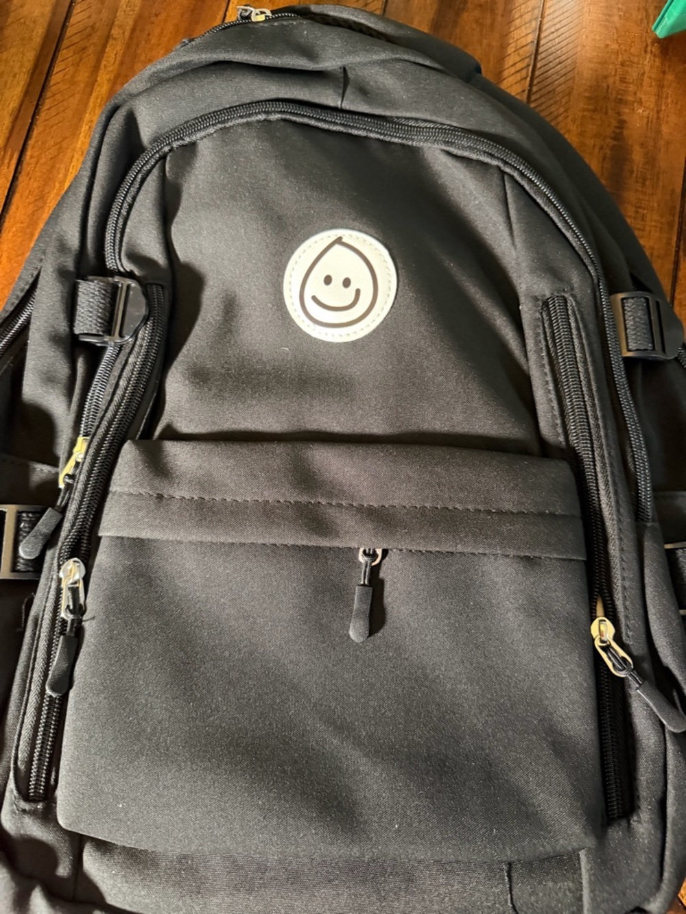 Black Backpack with Smiley Patch